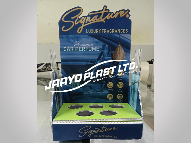 Printed counter display with cut-outs for car perfume bottles