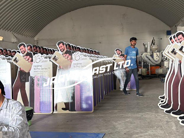 A production run of printed cut-out standees lined up at the plant