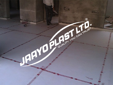 Floor protection sheets taped across a site floor